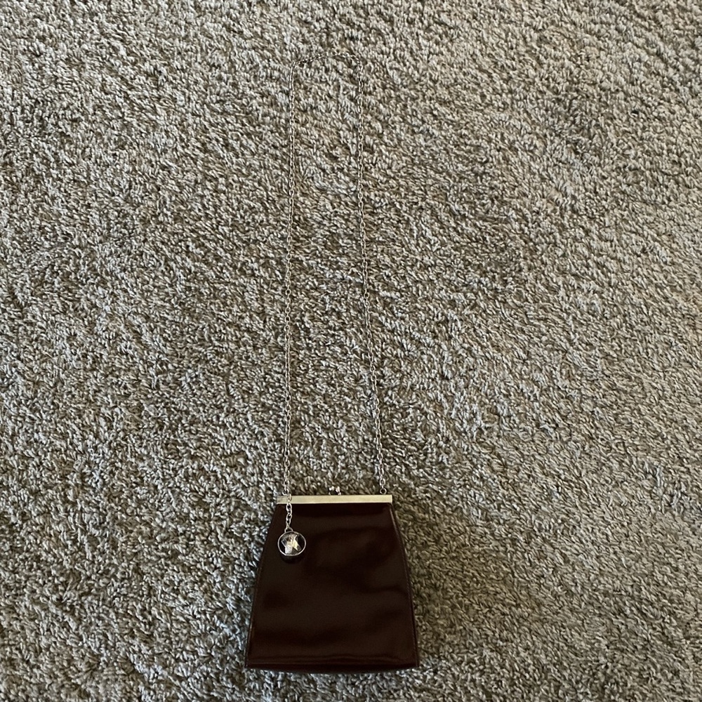 Vintage brown designer bag by: Paloma Picasso a dark brown color